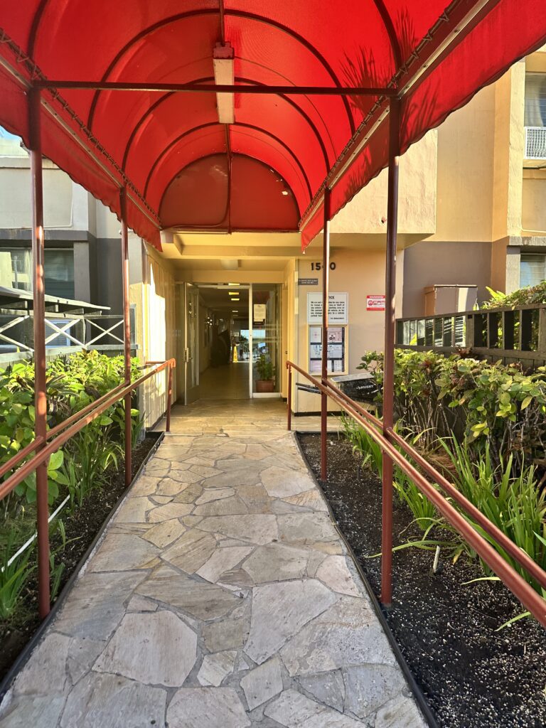 Hawai'i Travel News November 2023 | New Hotels & Flight Updates Hawaii Calling a walkway with a red canopy
