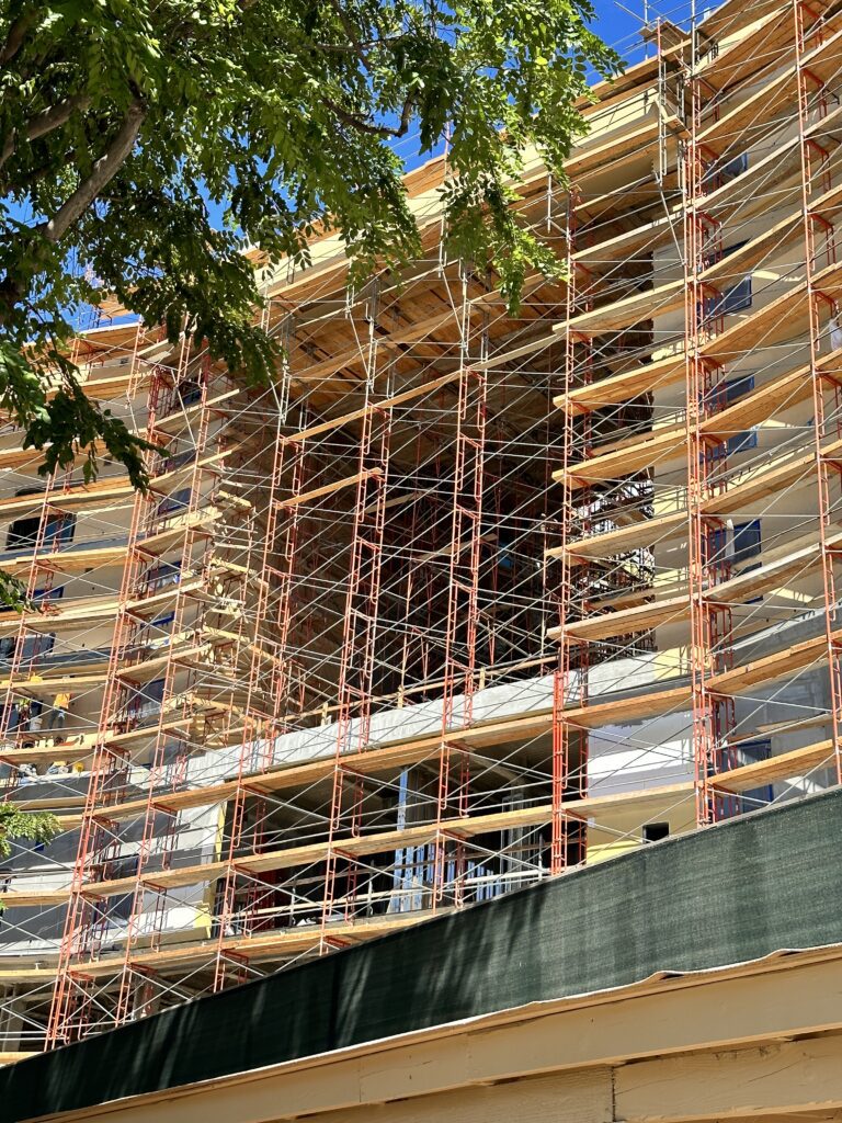 Hawai'i Travel News November 2023 | New Hotels & Flight Updates Hawaii Calling a building under construction with scaffolding