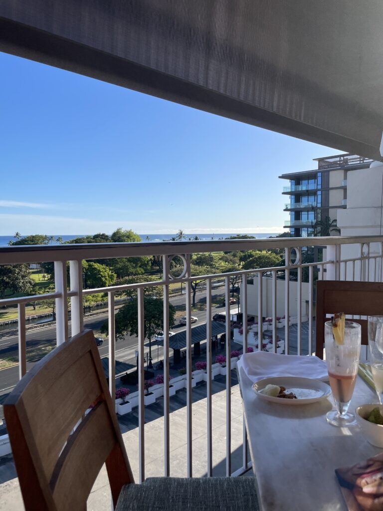 25 Best Restaurants in Hawaii for (2025) Hawaii Calling a table with food on it and a railing on a balcony
