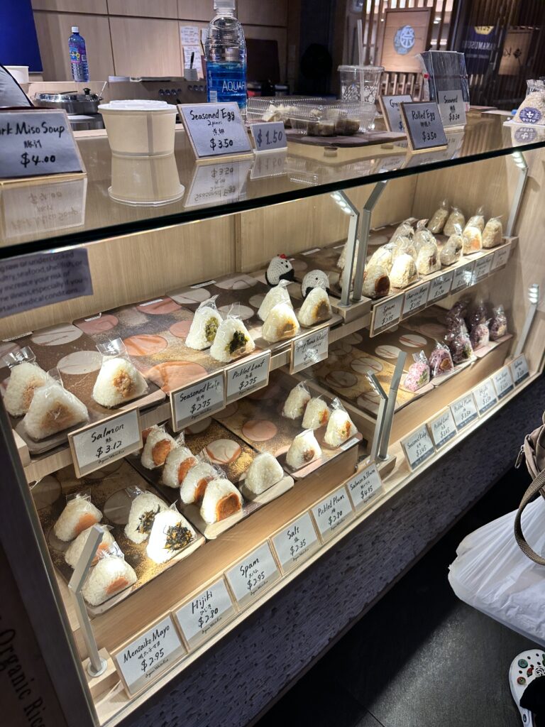 STIX Waikiki: A Foodie's Paradise in the Heart of Waikiki Beach Hawaii Calling a display case with food on it