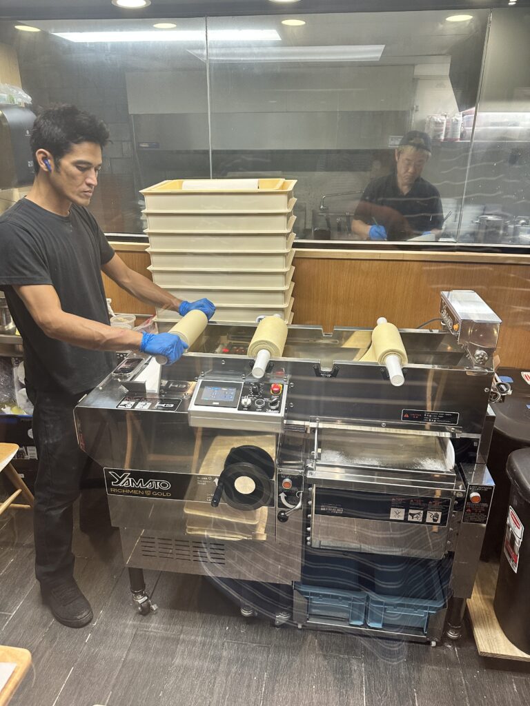 STIX Waikiki: A Foodie's Paradise in the Heart of Waikiki Beach Hawaii Calling a man in gloves working on a machine