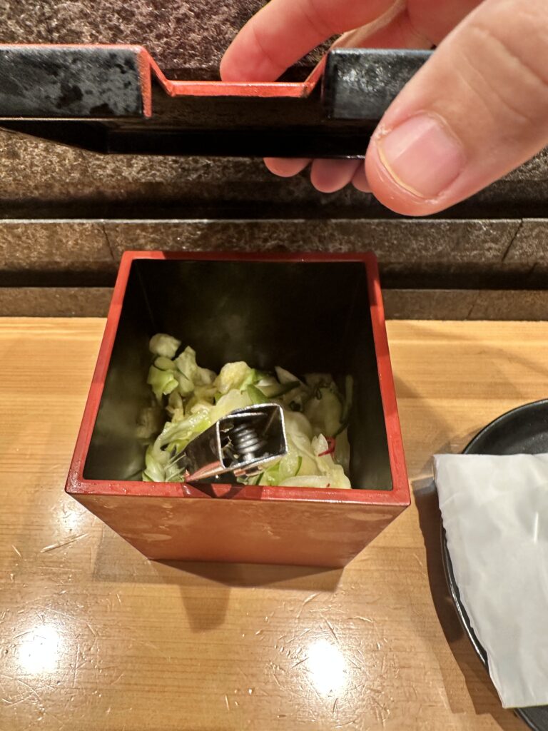 STIX Waikiki: A Foodie's Paradise in the Heart of Waikiki Beach Hawaii Calling a hand holding a metal object with food inside