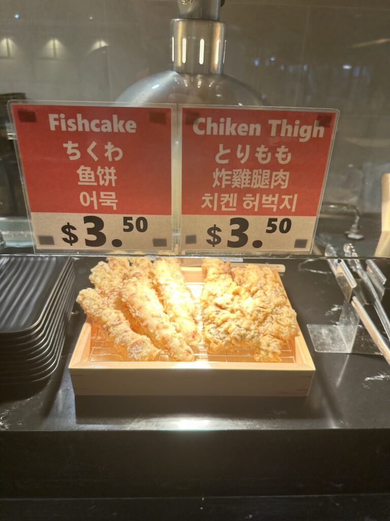 STIX Waikiki: A Foodie's Paradise in the Heart of Waikiki Beach Hawaii Calling a sign on a counter with food on it
