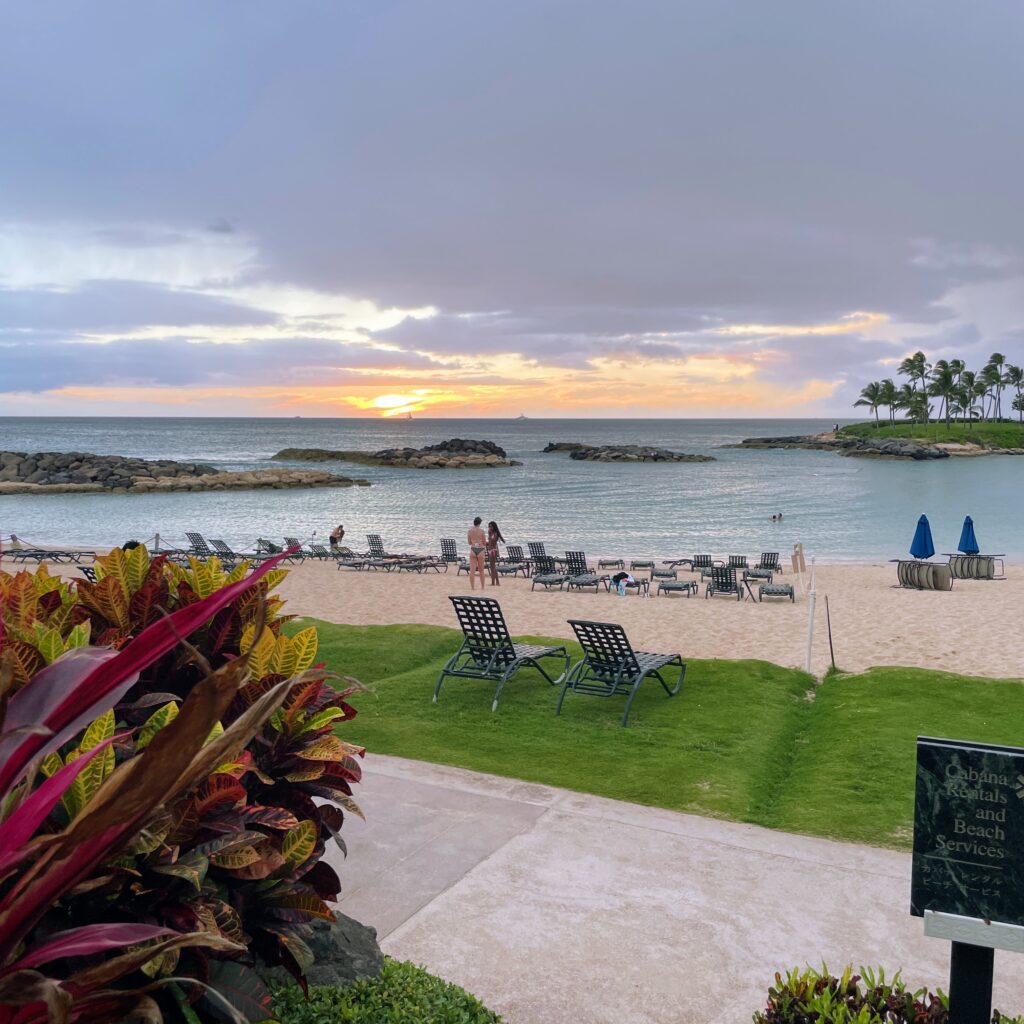 15 Best Beachfront Hotels On Oahu (2025) | Waterfront Bliss Hawaii Calling a beach with chairs and a body of water