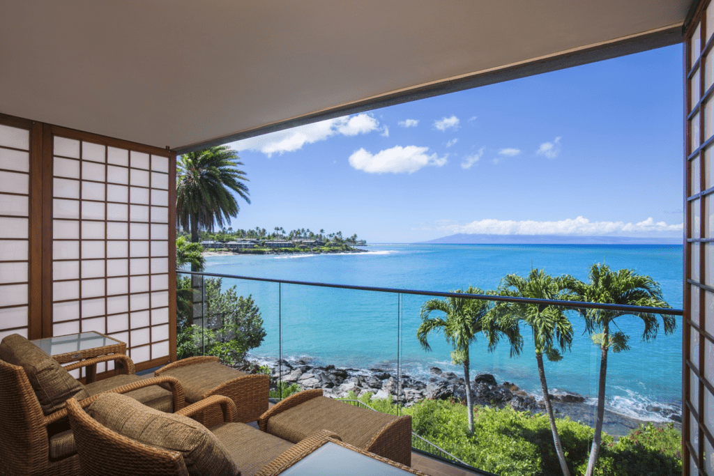 10 Best Family Hotels On Maui | Legendary Favorites (2025) Hawaii Calling a room with a view of the ocean and palm trees