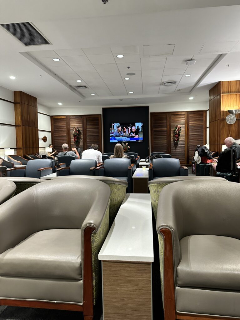 Delta Sky Club Honolulu | Guide & Review (2025) Hawaii Calling a group of people sitting in chairs in a room