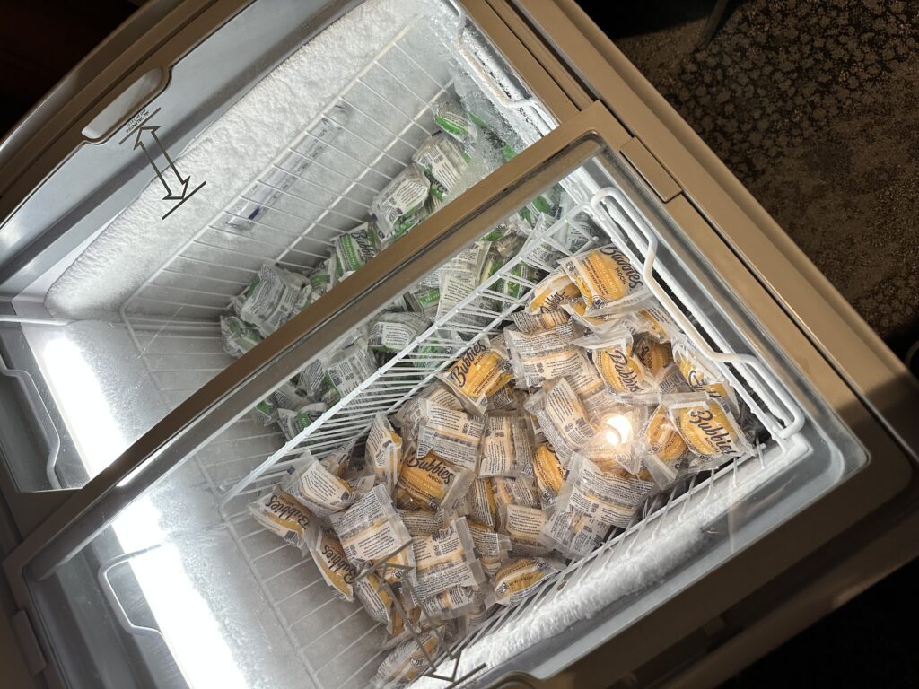 Delta Sky Club Honolulu | Guide & Review (2025) Hawaii Calling a freezer with a light bulb inside