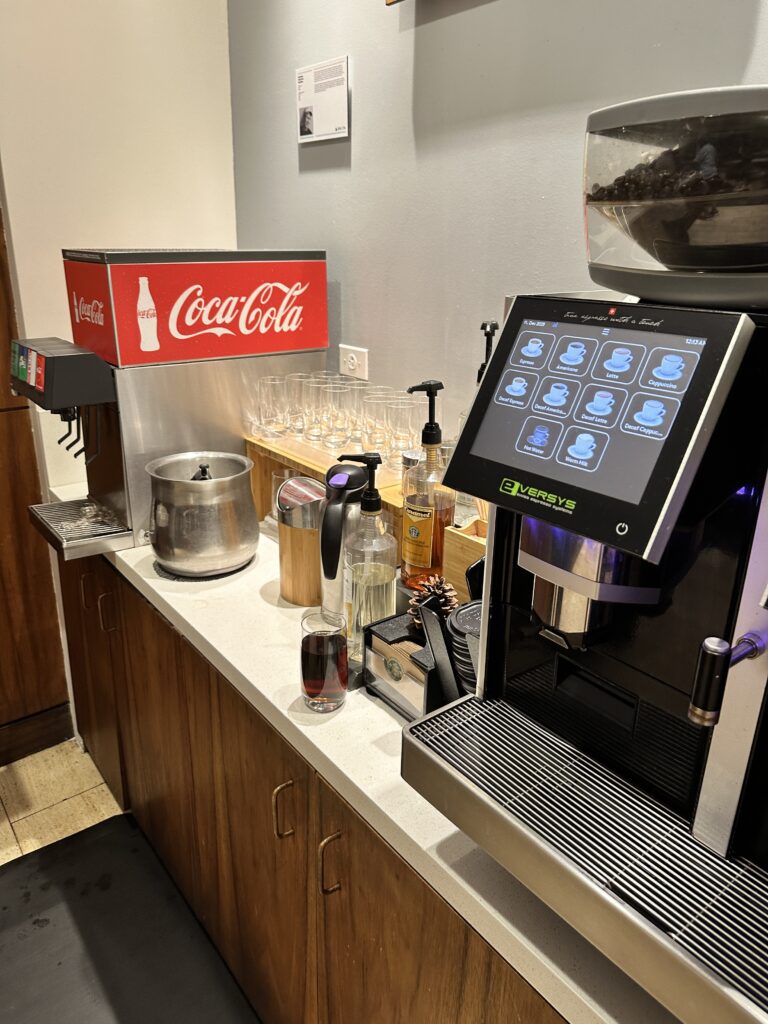 Delta Sky Club Honolulu | Guide & Review (2025) Hawaii Calling a coffee machine on a counter