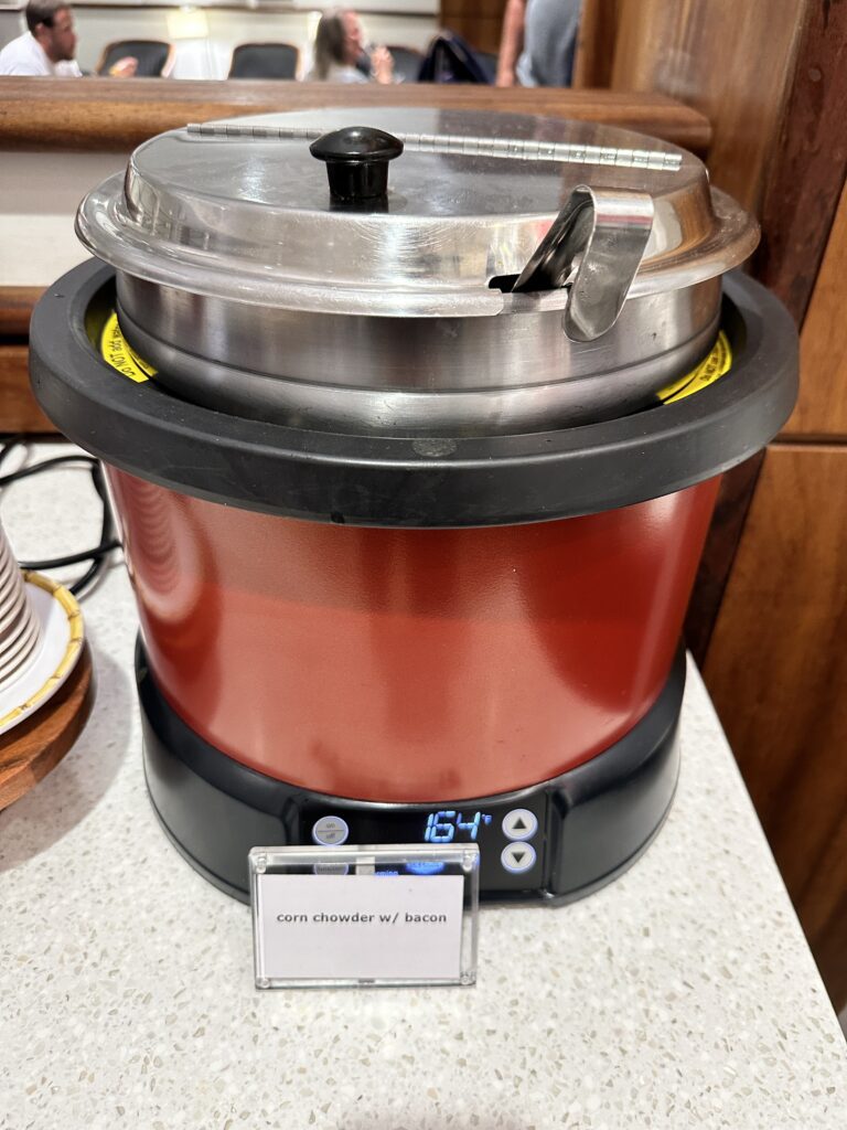 Delta Sky Club Honolulu | Guide & Review (2025) Hawaii Calling a red and black pot with a lid