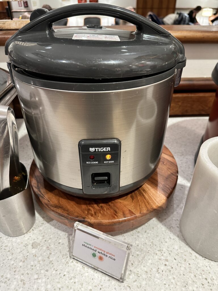 Delta Sky Club Honolulu | Guide & Review (2025) Hawaii Calling a close up of a rice cooker