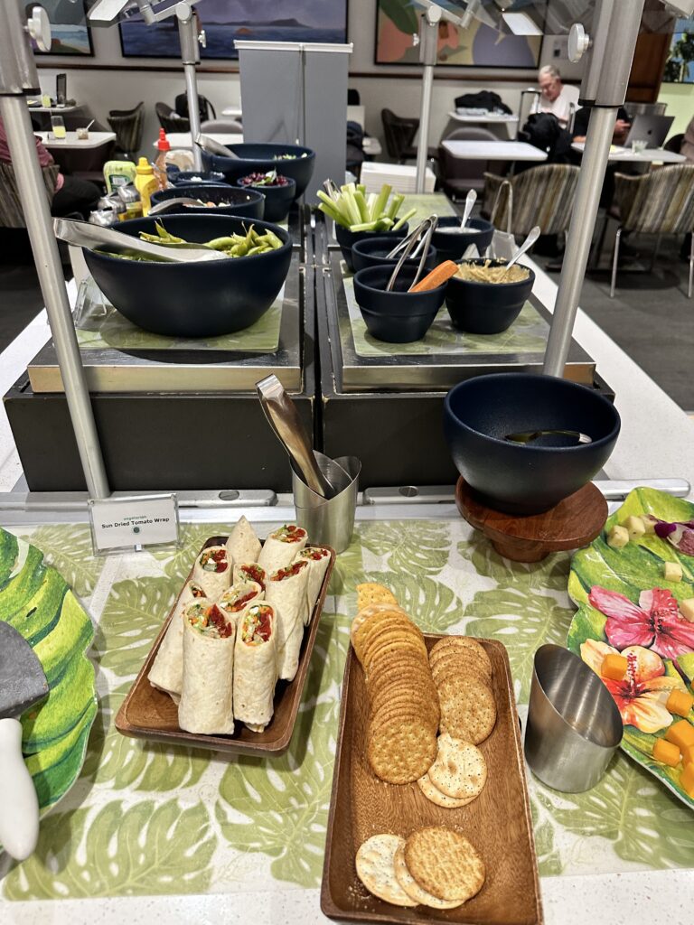 Delta Sky Club Honolulu | Guide & Review (2025) Hawaii Calling a table with food on it