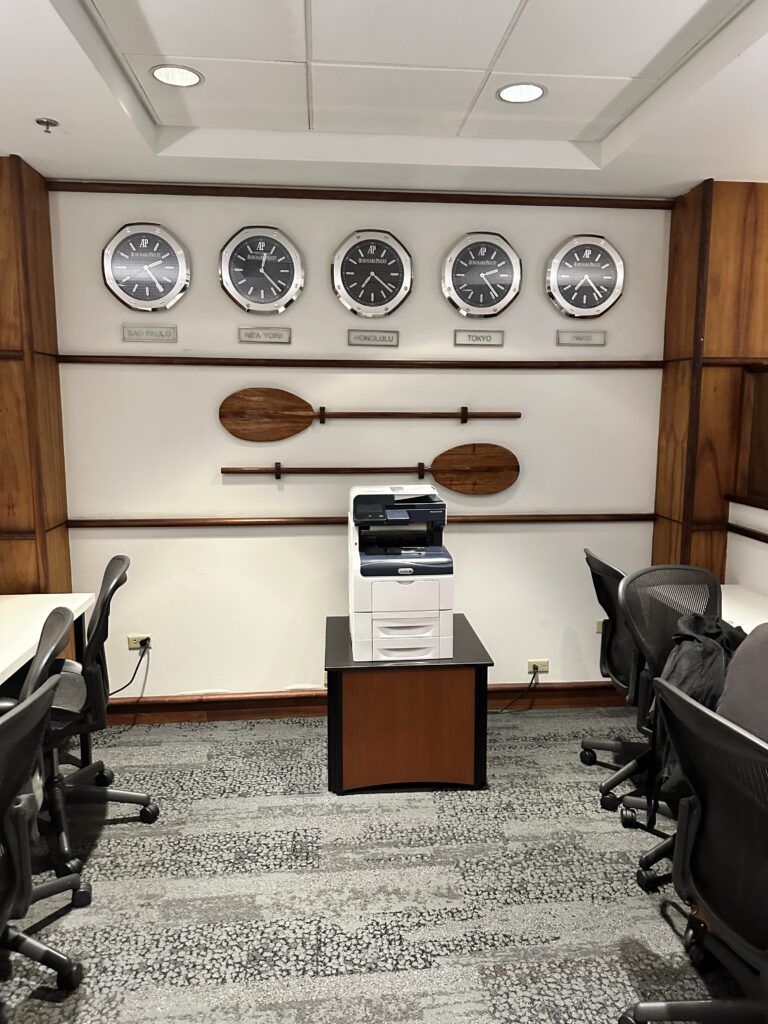Delta Sky Club Honolulu | Guide & Review (2025) Hawaii Calling a room with a printer and chairs and a paddle
