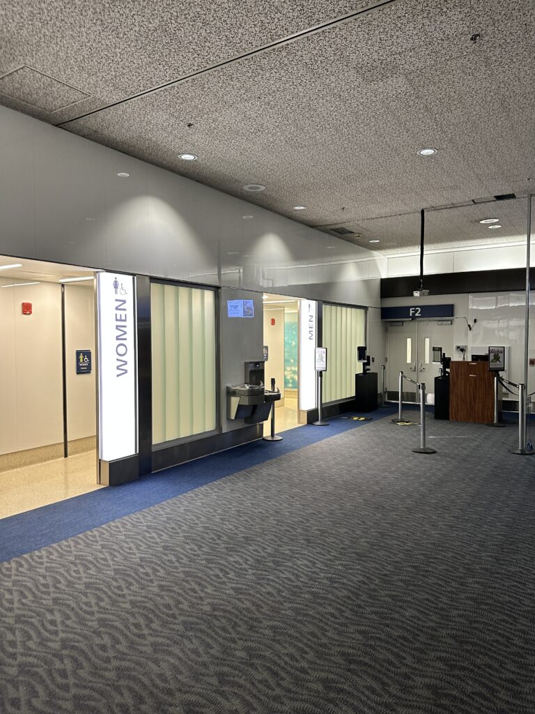 Review: Delta Airlines Economy A321NEO HNL-SEA (Honolulu to Seattle) Hawaii Calling a building with a glass wall and a door near gate F2 at the Honolulu Airport
