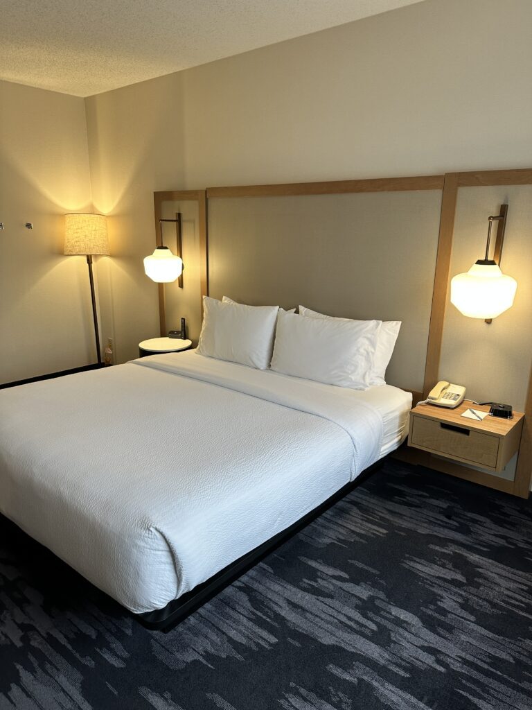 Review: Fairfield Inn & Suites Seattle Sea-Tac Airport Hawaii Calling a bed with white sheets and lamps