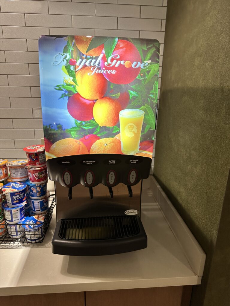 Review: Fairfield Inn & Suites Seattle Sea-Tac Airport Hawaii Calling a beverage dispenser with a poster on it