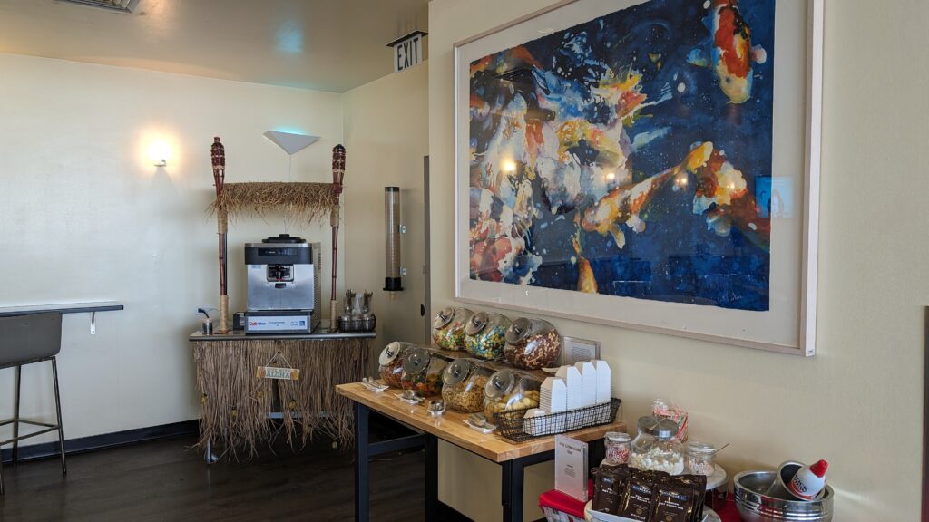 United Airlines Club Honolulu | Unique & Spacious Hawaii Calling a room with a painting of a fish