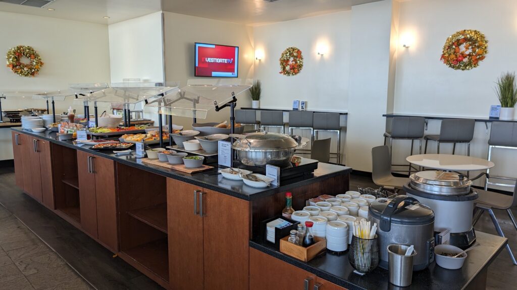 United Airlines Club Honolulu | Unique & Spacious Hawaii Calling a buffet table with food on it