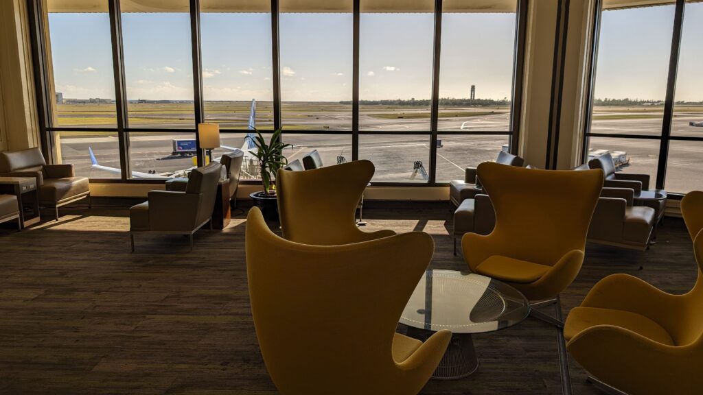United Airlines Club Honolulu | Unique & Spacious Hawaii Calling a room with chairs and a table