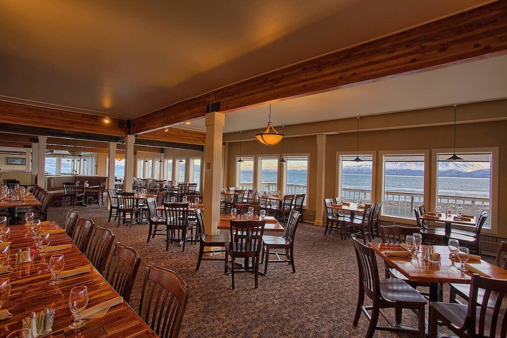 The 5 Best Budget Hotels in Alaska (2024) Hawaii Calling a room with tables and chairs