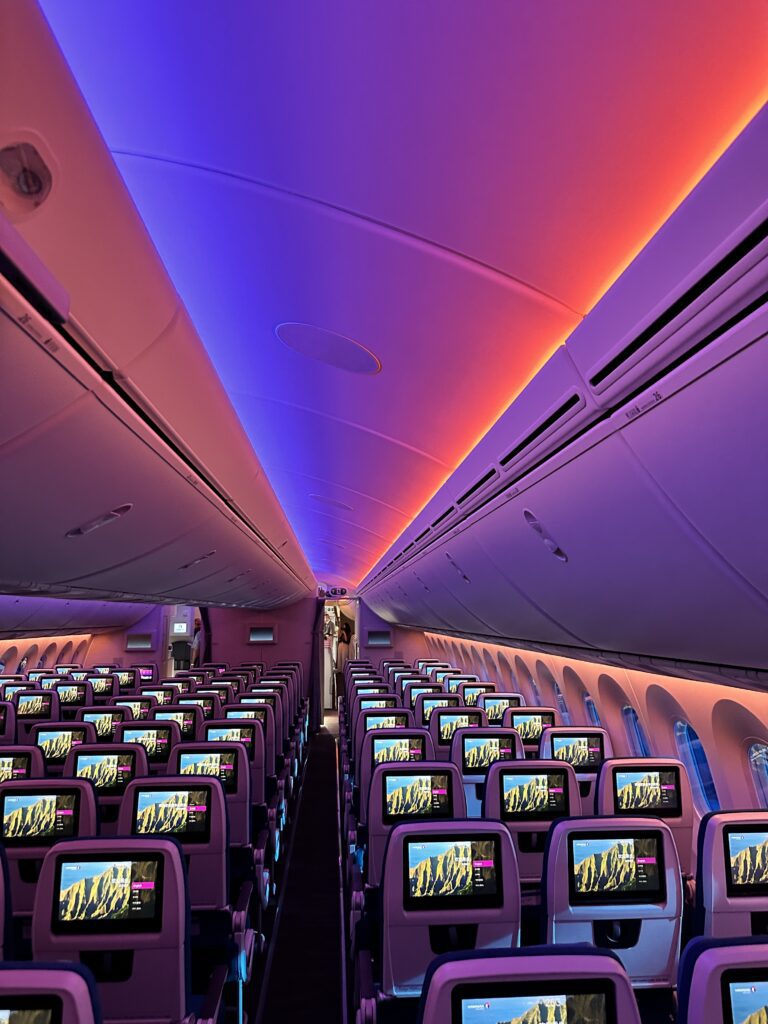Hawaiian Airlines Boeing 787 Dreamliner Walk Through Hawaii Calling rows of seats in an airplane