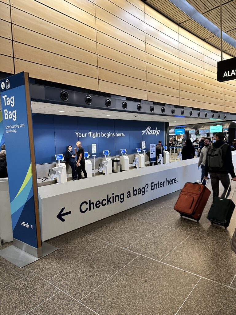 Review: Alaska Airlines Boeing 737 Max 9 First Class SEA-HNL Hawaii Calling people with luggage in a terminal