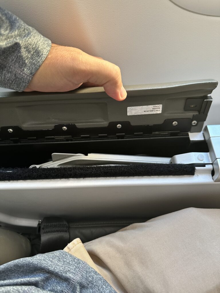 Review: Alaska Airlines Boeing 737 Max 9 First Class SEA-HNL Hawaii Calling a hand holding an object