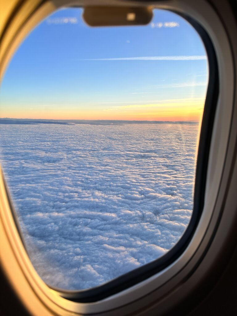 Review: Alaska Airlines Boeing 737 Max 9 First Class SEA-HNL Hawaii Calling a view of clouds from an airplane window