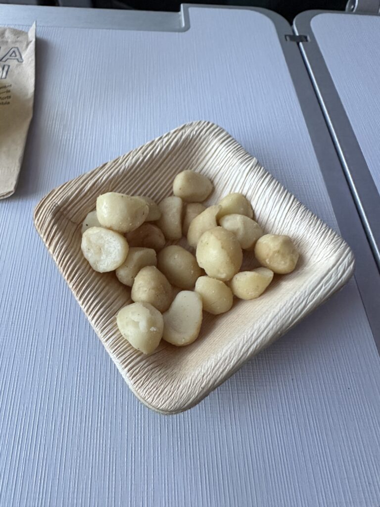 Review: Alaska Airlines Boeing 737 Max 9 First Class SEA-HNL Hawaii Calling a bowl of food on a table