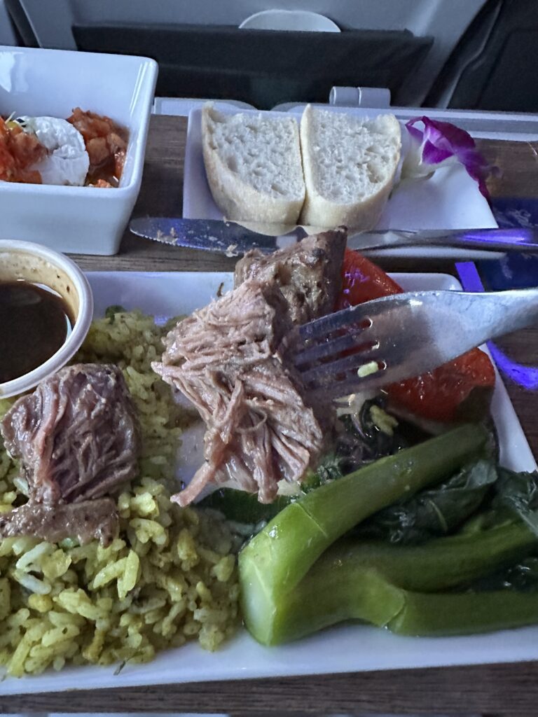 Review: Alaska Airlines Boeing 737 Max 9 First Class SEA-HNL Hawaii Calling a plate of food with a fork