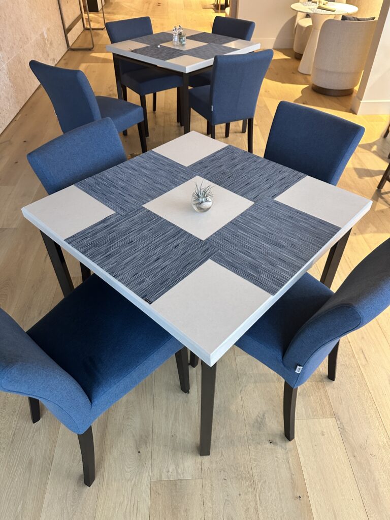 Review: Renaissance Honolulu Hotel & Spa | Oahu's Newest Hotel Hawaii Calling a table with blue chairs around it
