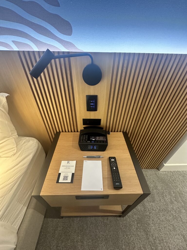 Review: Renaissance Honolulu Hotel & Spa | Oahu's Newest Hotel Hawaii Calling a desk with a phone and remote control
