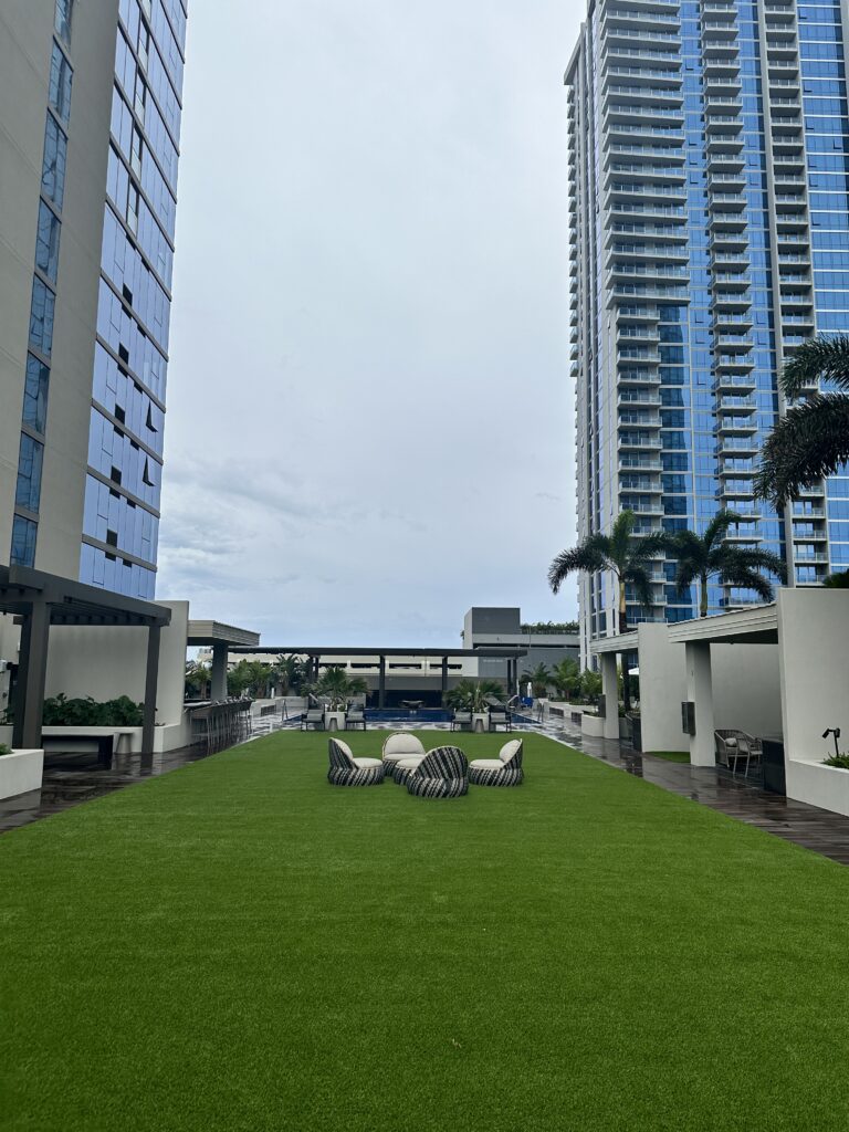 Review: Renaissance Honolulu Hotel & Spa | Oahu's Newest Hotel Hawaii Calling a lawn with chairs and trees in front of a building
