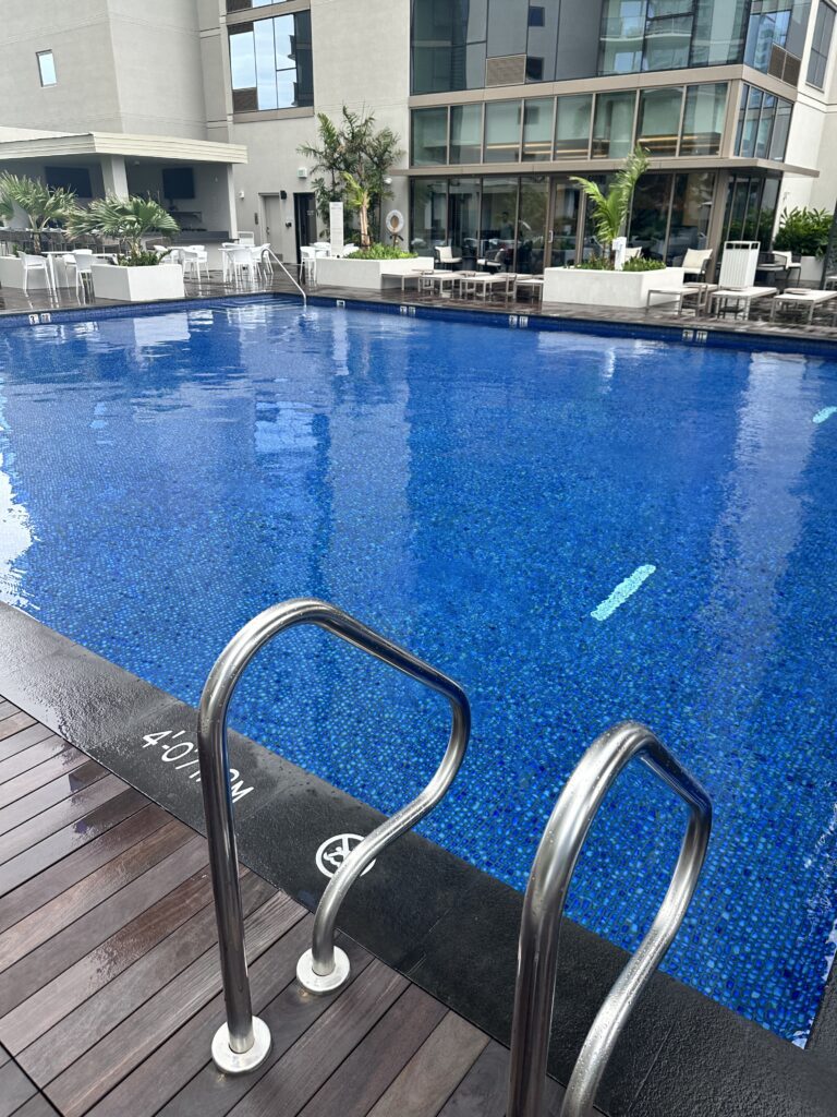 Review: Renaissance Honolulu Hotel & Spa | Oahu's Newest Hotel Hawaii Calling a swimming pool with a deck and chairs