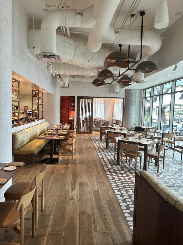 Review: Renaissance Honolulu Hotel & Spa | Oahu's Newest Hotel Hawaii Calling a restaurant with tables and chairs