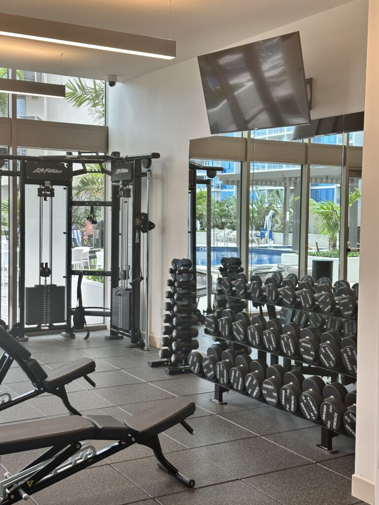 Review: Renaissance Honolulu Hotel & Spa | Oahu's Newest Hotel Hawaii Calling a room with weights and a television