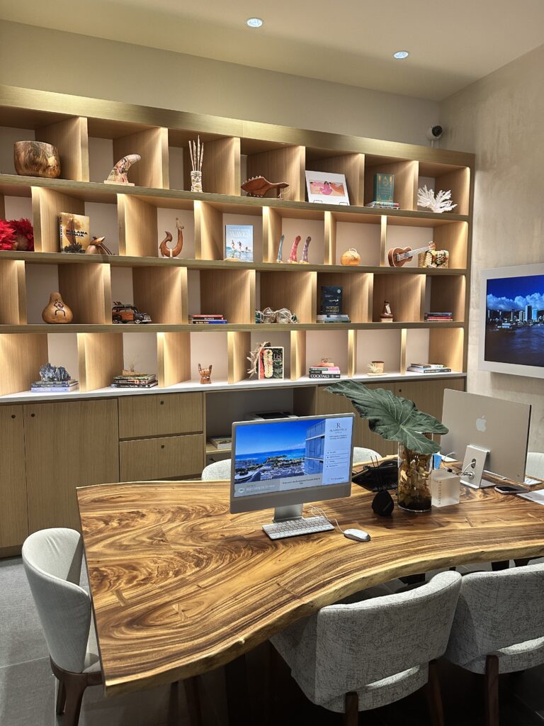Review: Renaissance Honolulu Hotel & Spa | Oahu's Newest Hotel Hawaii Calling a desk with a computer and a shelf with pictures