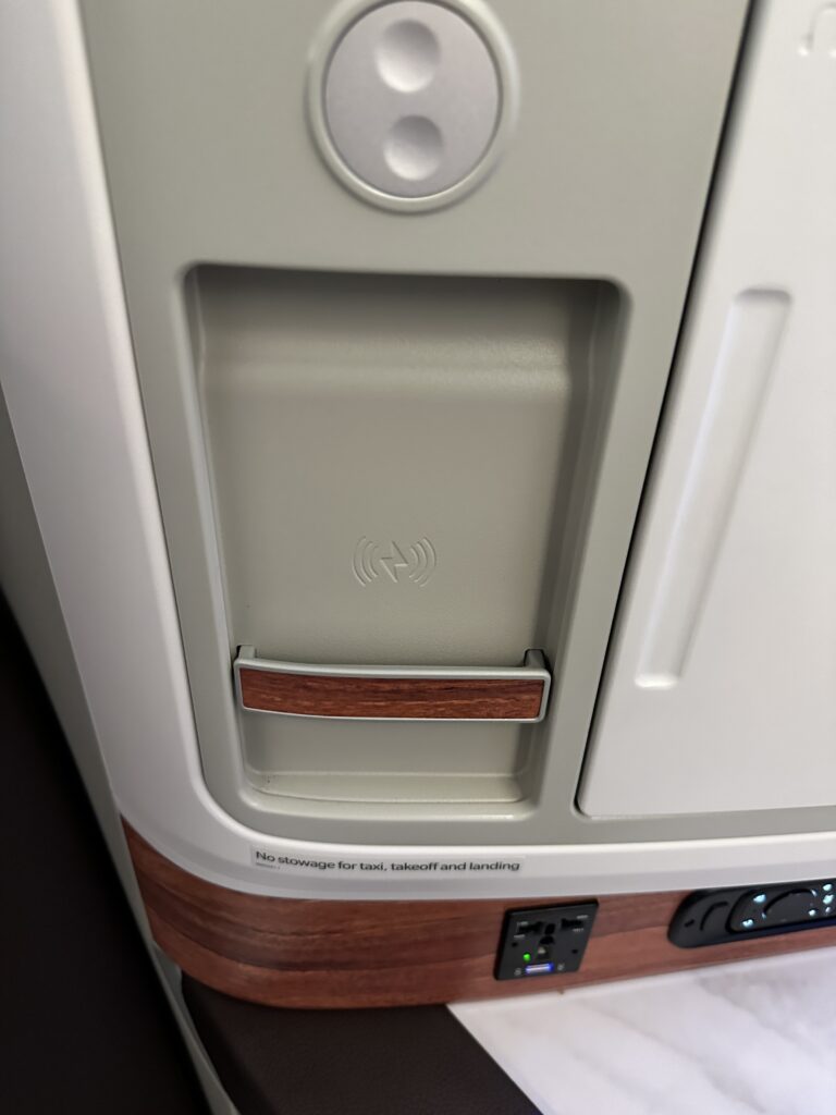 A First Class Experience on Hawaiian Airlines Boeing 787 Dreamliner | Leihōkū Suites | HNL-SFO Hawaii Calling a close up of a device