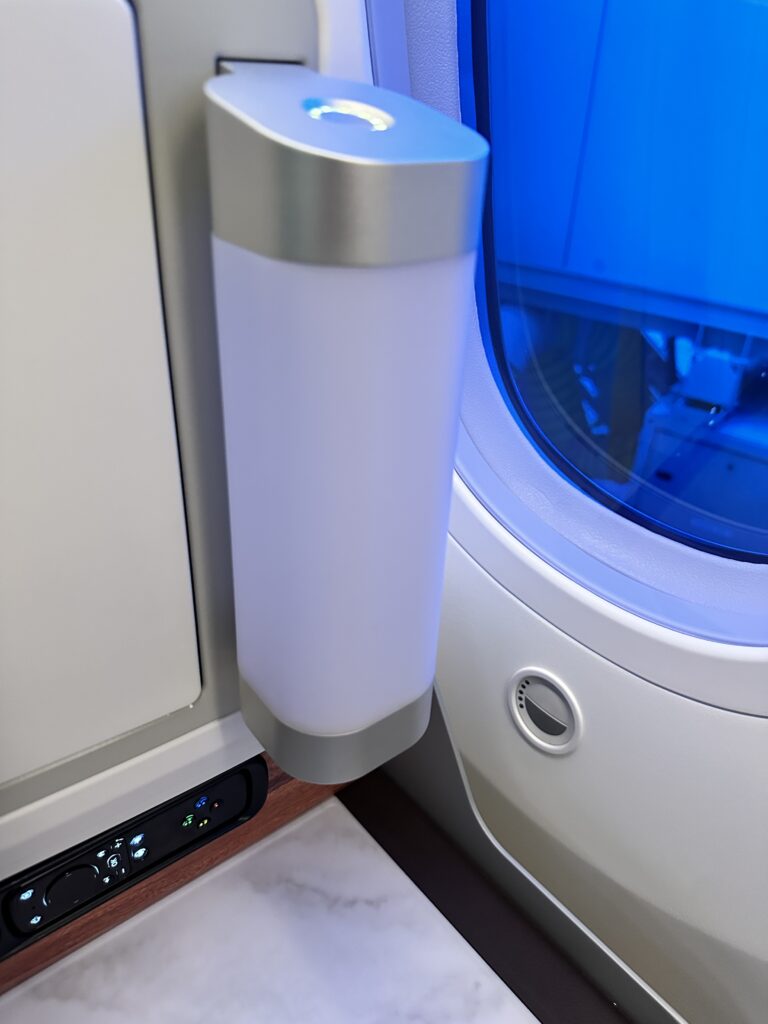 A First Class Experience on Hawaiian Airlines Boeing 787 Dreamliner | Leihōkū Suites | HNL-SFO Hawaii Calling a white object next to a window