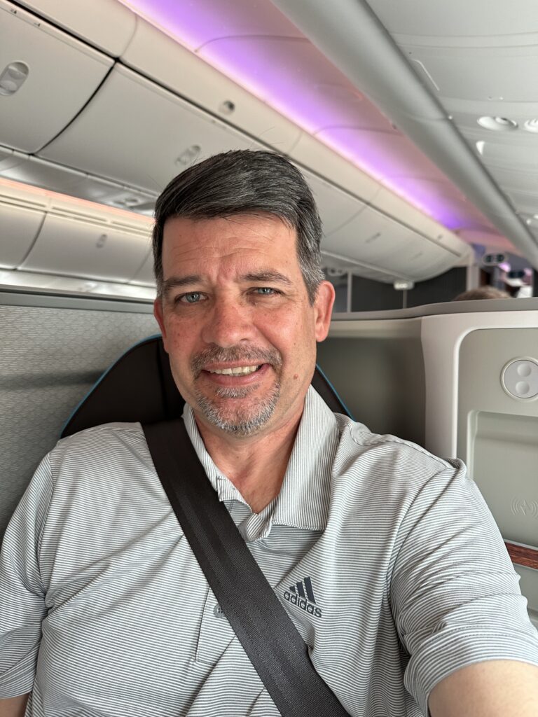 A First Class Experience on Hawaiian Airlines Boeing 787 Dreamliner | Leihōkū Suites | HNL-SFO Hawaii Calling a man sitting in an airplane