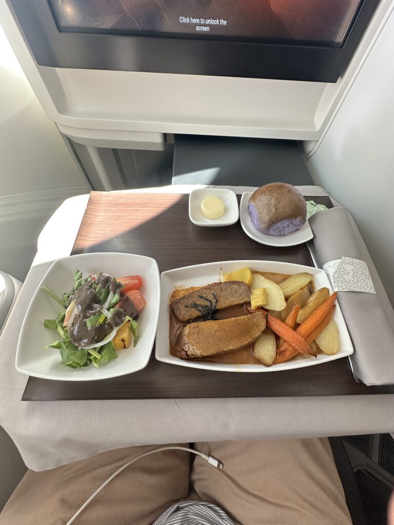 A First Class Experience on Hawaiian Airlines Boeing 787 Dreamliner | Leihōkū Suites | HNL-SFO Hawaii Calling a tray with food on it