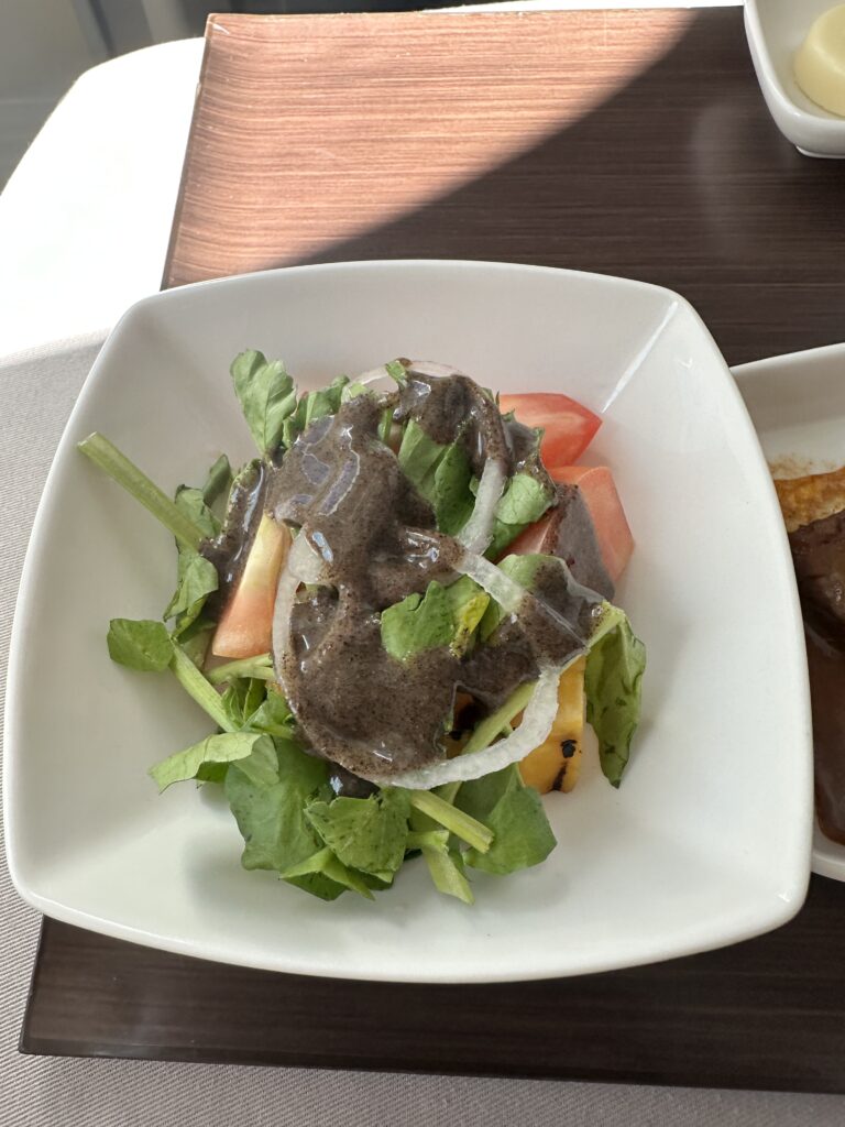 A First Class Experience on Hawaiian Airlines Boeing 787 Dreamliner | Leihōkū Suites | HNL-SFO Hawaii Calling a salad in a white bowl