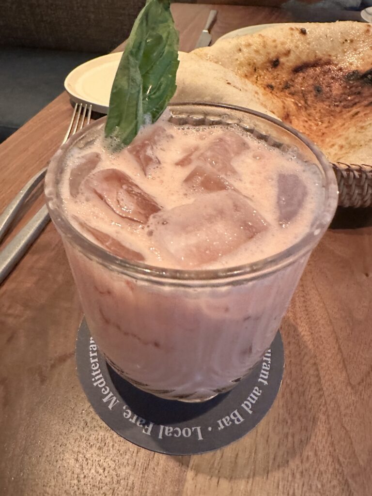Review: Renaissance Honolulu Hotel & Spa | Oahu's Newest Hotel Hawaii Calling a glass of ice drink with ice cubes and a leaf on top