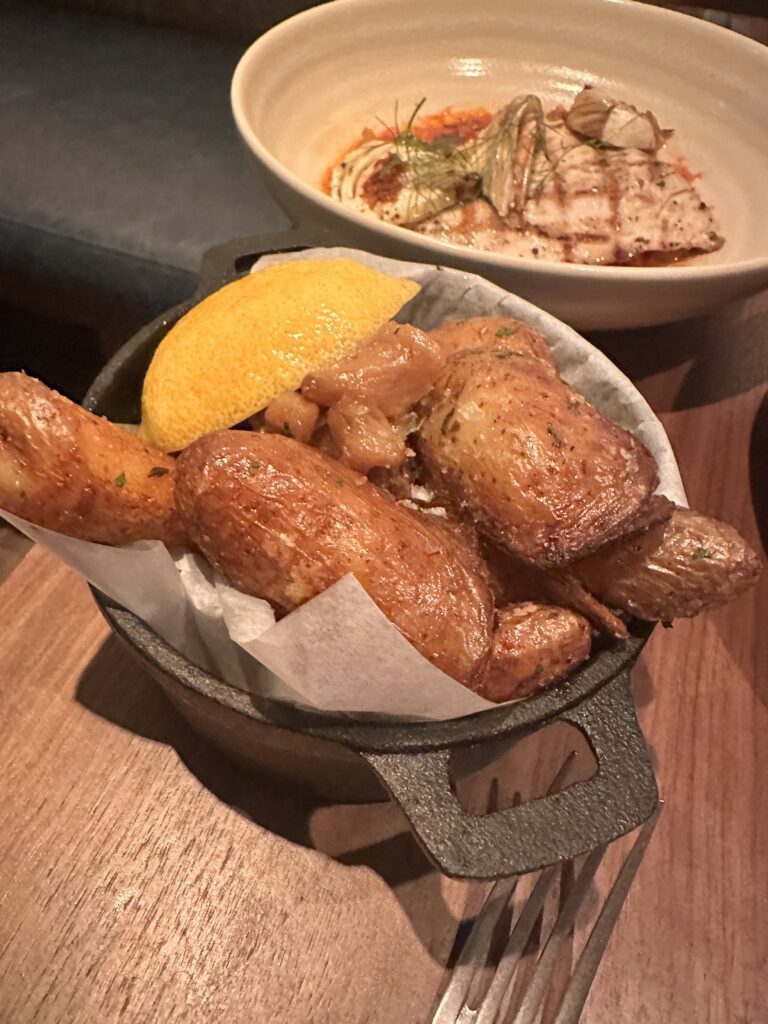 Review: Renaissance Honolulu Hotel & Spa | Oahu's Newest Hotel Hawaii Calling a pan of food with a lemon wedge and a plate of food