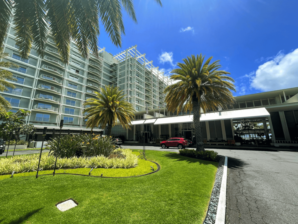 From Pools to IV Drips: Are Wellness Treatments the Future of Resort Amenities? Hawaii Calling a building with palm trees and a parking lot