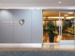 a building with glass doors and a sign
