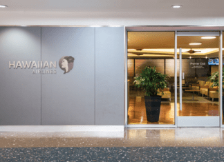 Guide to Hawaiian Airlines Lounges: Premier, Plumeria, and International Partner Lounges a building with glass doors and a sign