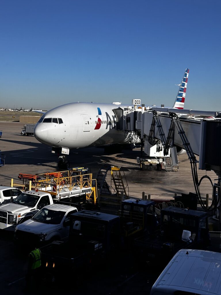 American Airlines DFW-HNL Premium Economy Review | Boeing 777 Hawaii Calling an airplane at an airport