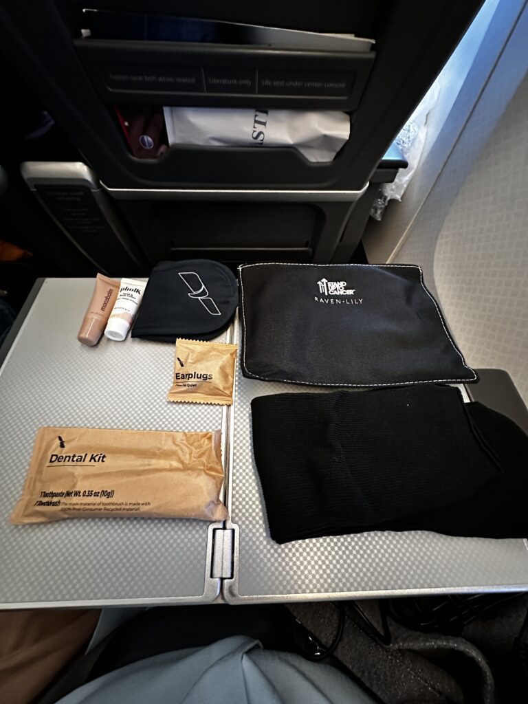 American Airlines DFW-HNL Premium Economy Review | Boeing 777 Hawaii Calling a group of items on a table