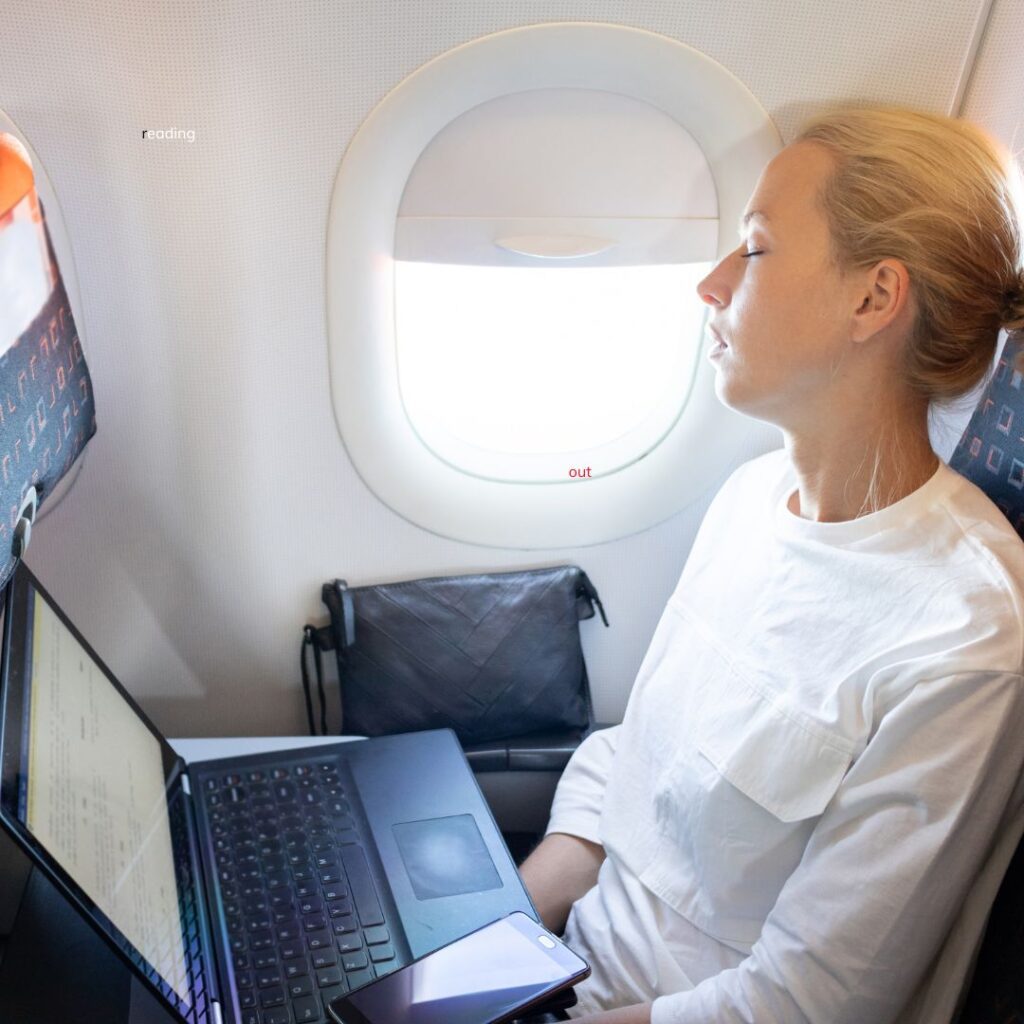 25 Fun & Creative Things To Do On A Long Flight To Hawai'i Hawaii Calling a woman sitting on a plane with a laptop