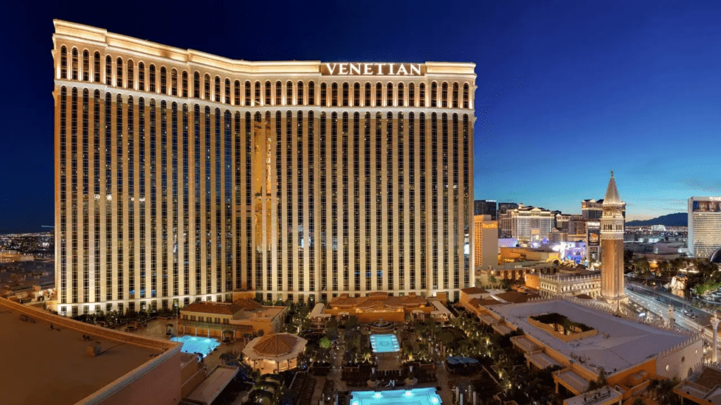 Hyatt and The Venetian Team Up: A Game-Changing Opportunity for Hawai‘i’s Vegas-Bound Travelers Hawaii Calling a large building with lights on it with Monte Carlo Resort and Casino in the background